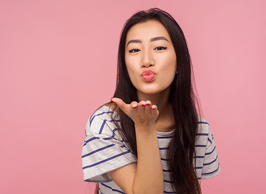 A girl blowing a kiss