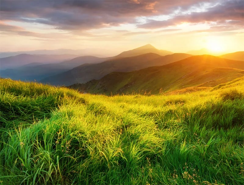 A view of mountains at sunset