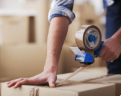 A box being sealed with packing tape