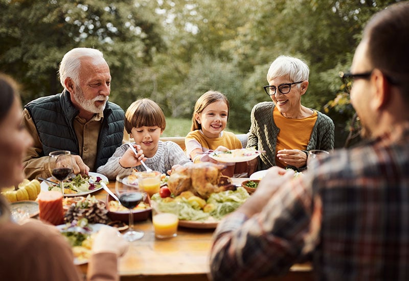 A family enjoying a meal outside