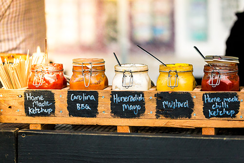 A selection of fresh sauces including ketchup, BBQ, mayo and mustard