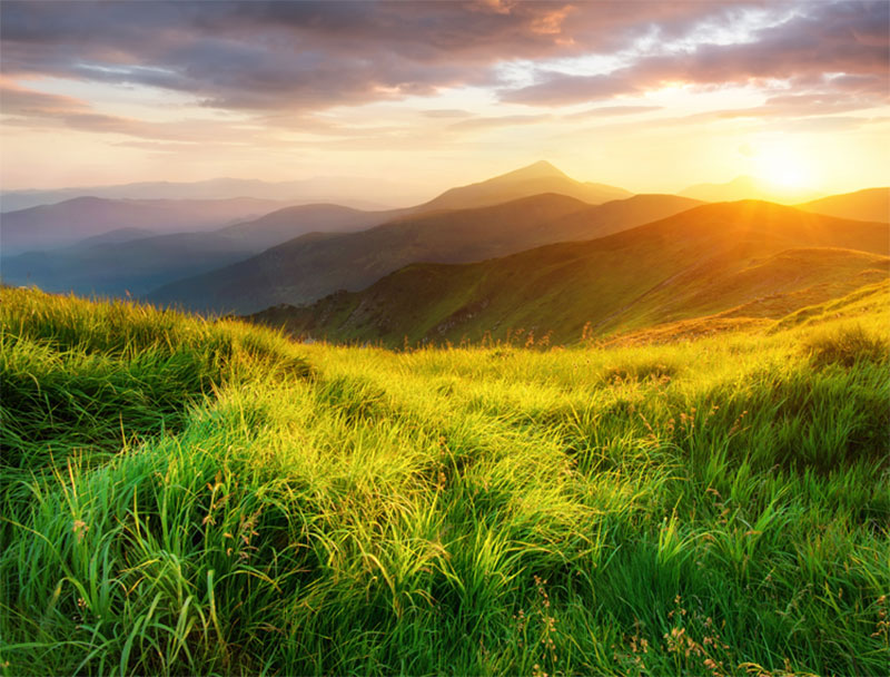 A view of mountains at sunset