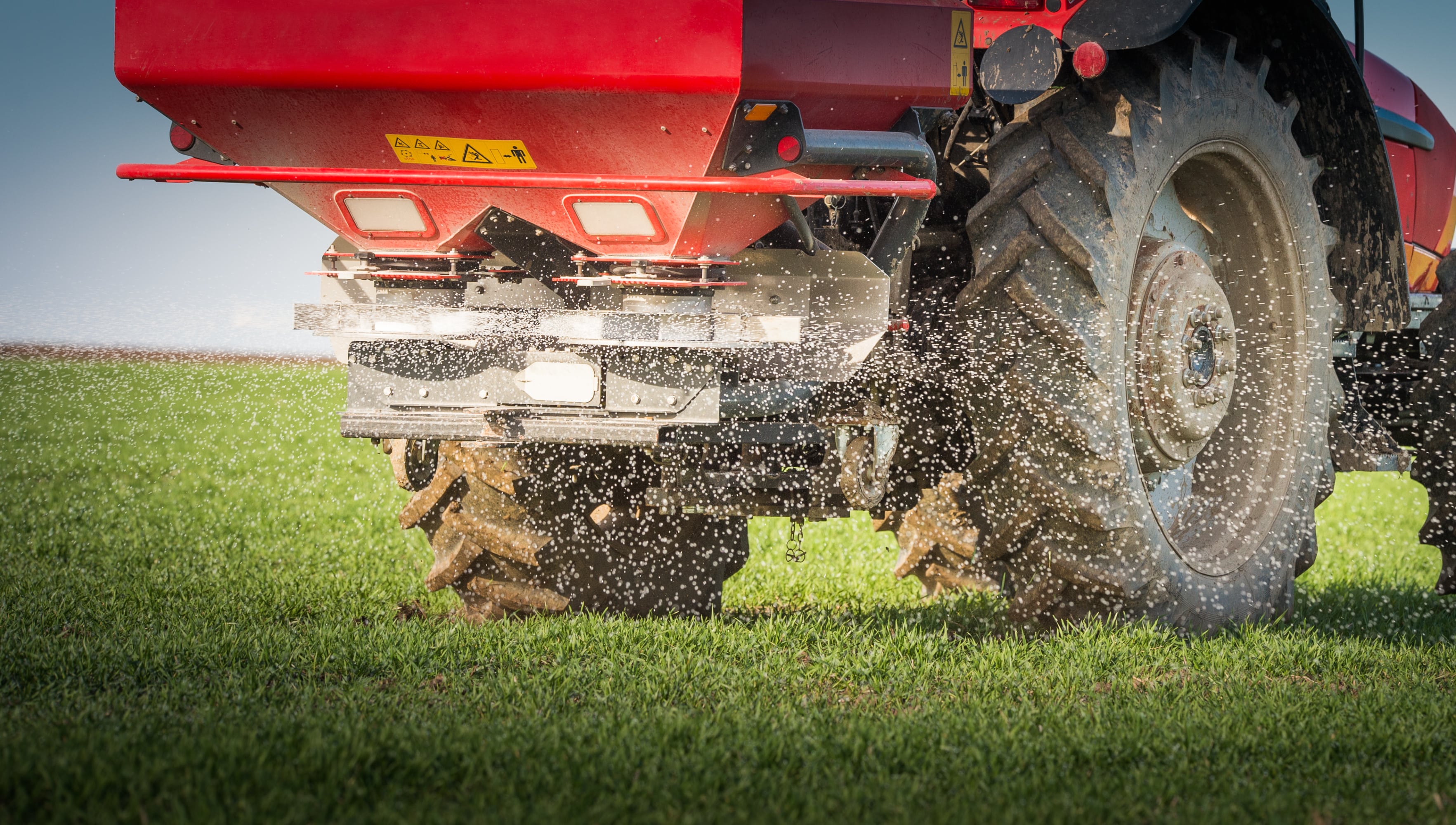 A tractor spreading fertilizers